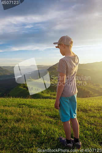 Image of Young explorer at the sunset