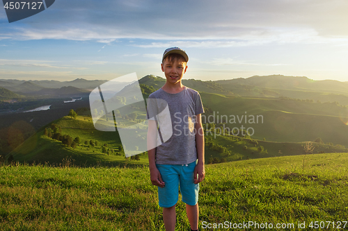 Image of Young explorer at the sunset