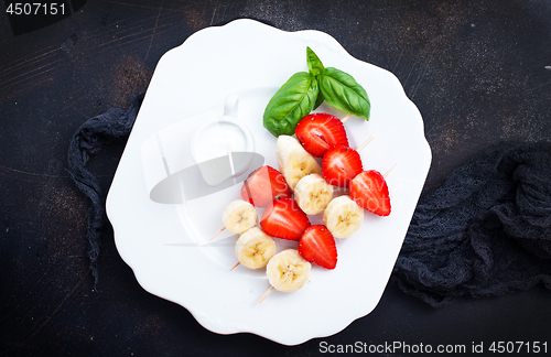 Image of banana with strawberry