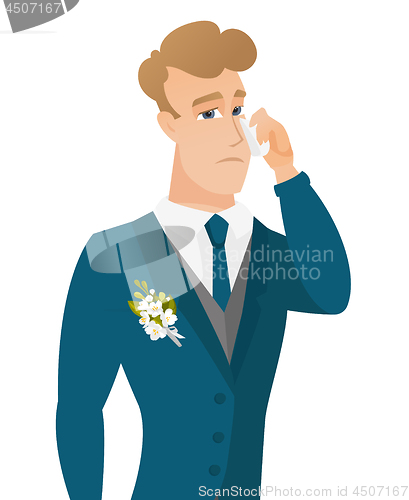 Image of Young caucasian groom crying.