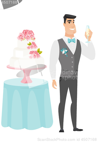 Image of Groom standing near cake with glass of champagne.