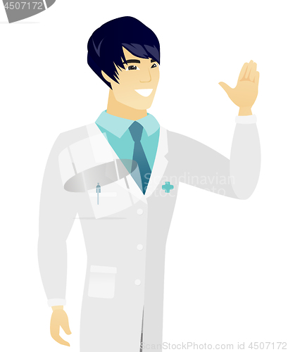 Image of Young asian doctor waving his hand.