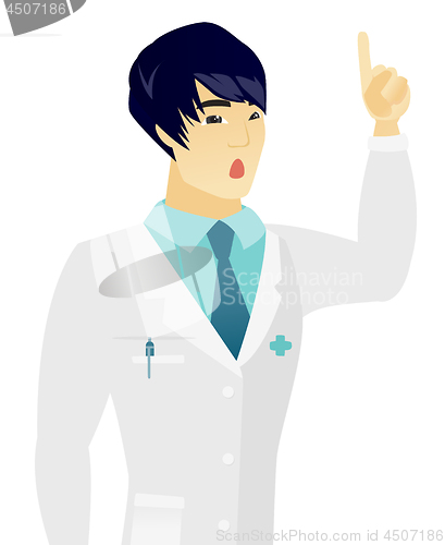 Image of Asian doctor with open mouth pointing finger up.