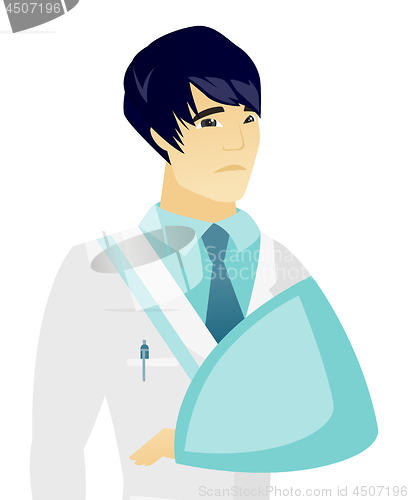 Image of Young asian doctor with broken arm.