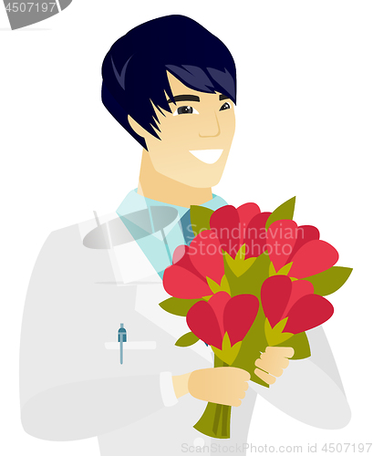 Image of Young asian doctor holding a bouquet of flowers.