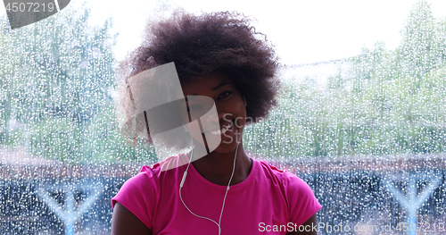 Image of portrait of young afro american woman in gym