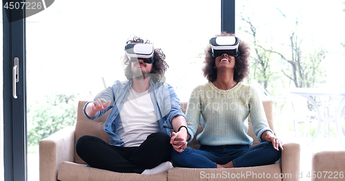 Image of Multiethnic Couple using virtual reality headset