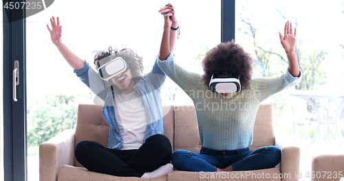 Image of Multiethnic Couple using virtual reality headset