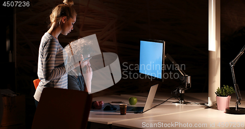 Image of young designers in the night office