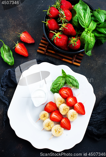Image of banana with strawberry
