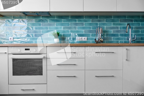 Image of Modern white kitchen a background