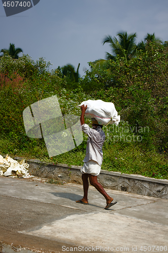 Image of Baggage handler - toil of Indian coolie worker