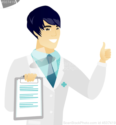 Image of Young asian doctor with clipboard giving thumb up.