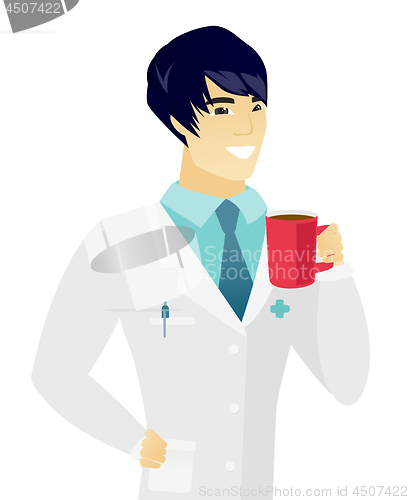 Image of Young asian doctor holding cup of coffee.