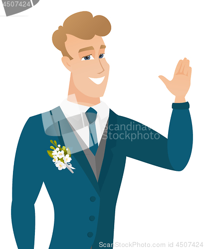 Image of Young caucasian groom waving his hand.