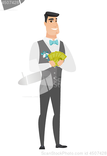 Image of Happy caucasian groom holding money.