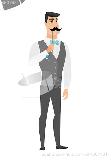 Image of Cheerful groom with a fake mustache.