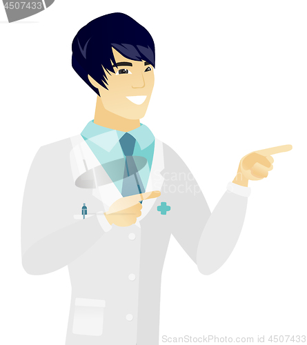 Image of Young asian doctor pointing to the side.