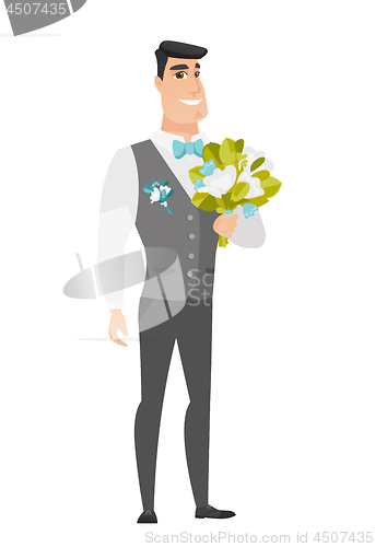 Image of Young caucasian groom with a bridal bouquet.