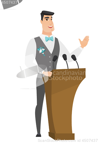 Image of Caucasian groom giving a speech from tribune.