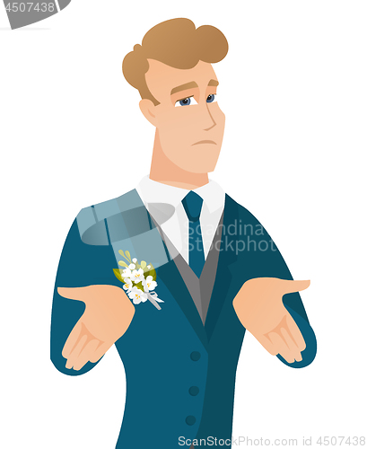 Image of Young caucasian confused groom shrugging shoulders
