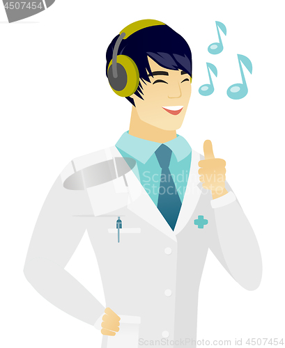 Image of Asian doctor listening to music in headphones.