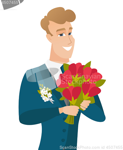 Image of Young caucasian groom with bridal bouquet.