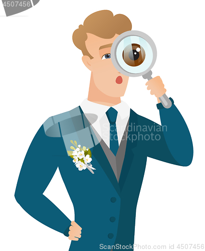 Image of Young caucasian groom with magnifying glass.