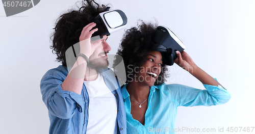 Image of multiethnic couple getting experience using VR headset glasses