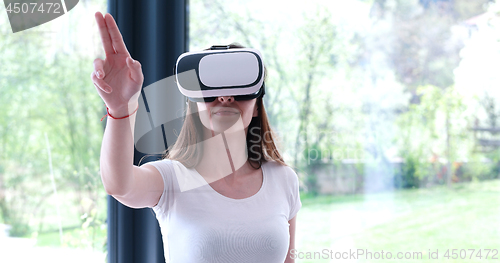 Image of woman using VR-headset glasses of virtual reality
