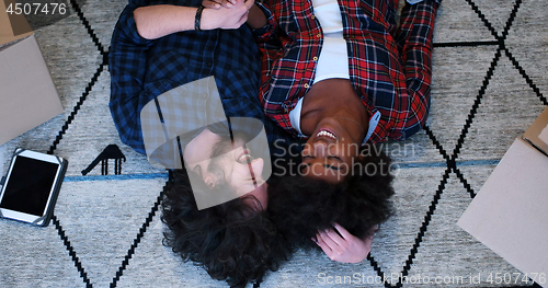 Image of Top view of attractive young multiethnic couple