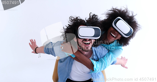Image of multiethnic couple getting experience using VR headset glasses