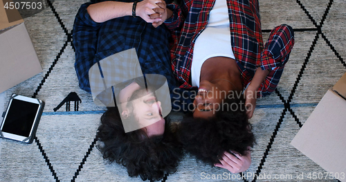 Image of Top view of attractive young multiethnic couple