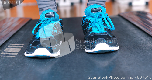 Image of black female feet in sneakers