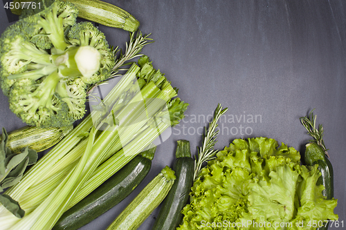 Image of Variety of green vegetables and herbs. Clean eating food concept