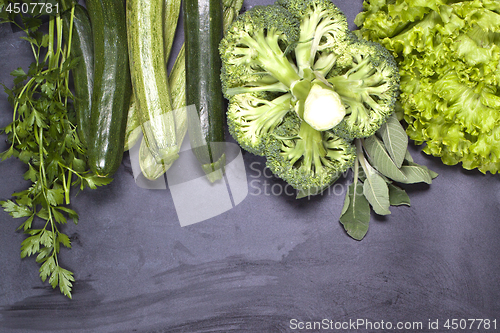 Image of Variety of green vegetables and herbs. Clean eating food concept