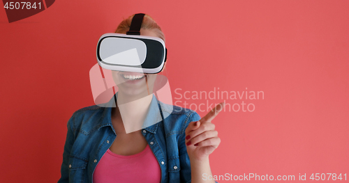 Image of young girl using VR headset glasses of virtual reality