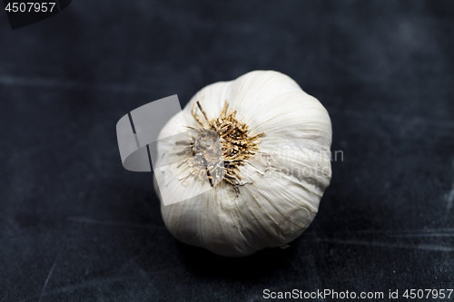 Image of Fresh raw organic garlic on black board.