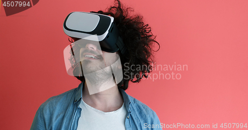 Image of young man using VR headset glasses of virtual reality