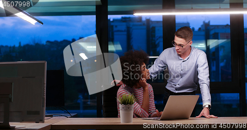 Image of Multiethnic startup business team in night office