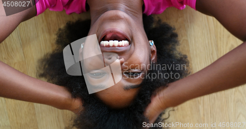 Image of portrait of young afro american woman in gym on workout break