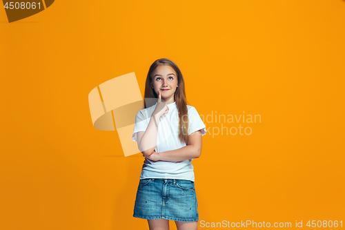 Image of Young serious thoughtful teen girl. Doubt concept.