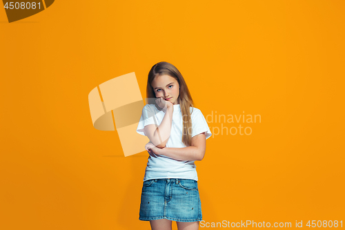 Image of Young serious thoughtful teen girl. Doubt concept.