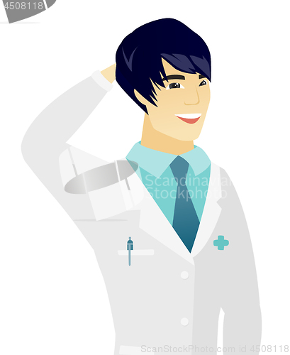Image of Young asian doctor in medical gown laughing.