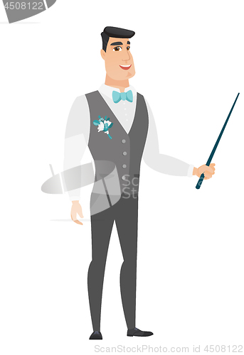 Image of Caucasian groom holding pointer stick.