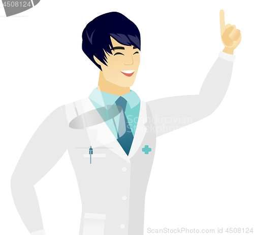 Image of Young asian doctor pointing with his forefinger.