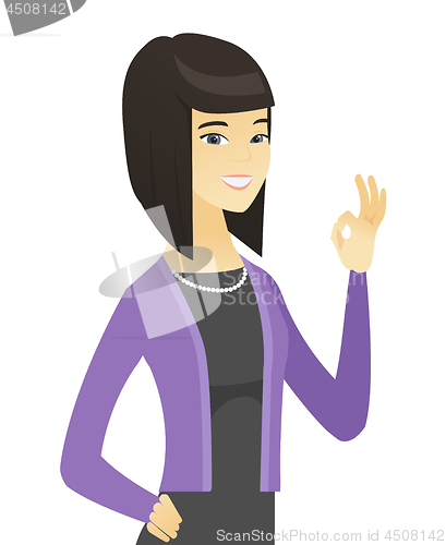 Image of Smiling asian business woman showing ok sign.