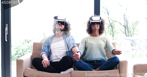 Image of Multiethnic Couple using virtual reality headset