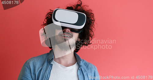 Image of young man using VR headset glasses of virtual reality