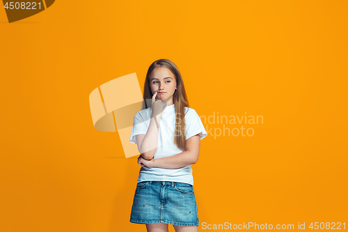 Image of Young serious thoughtful teen girl. Doubt concept.